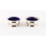 Property of a deceased estate - a pair of George III silver circular tub salts, with reeded