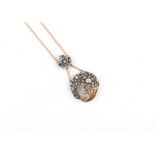 A Continental yellow gold diamond cornucopia pendant necklace, set with rose cut diamonds, with tied