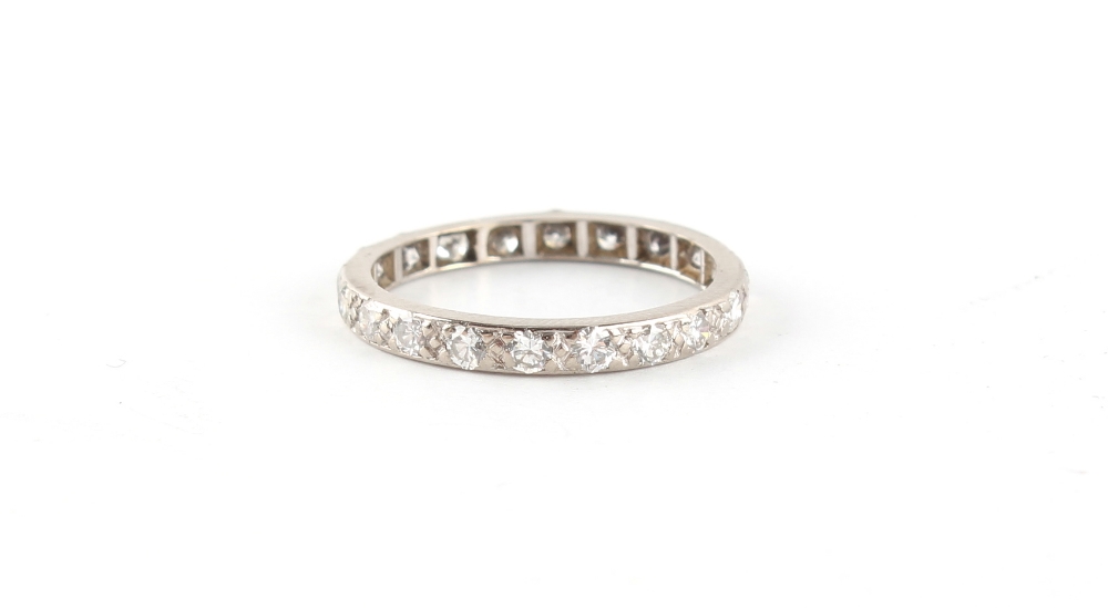 A platinum or white gold diamond eternity ring, size M.