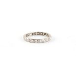 A platinum or white gold diamond eternity ring, size M.
