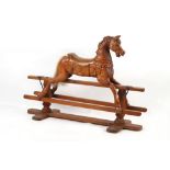 Property of a gentleman - a carved wooden rocking horse, 28.75ins. (73cms.) to saddle, 39ins. (