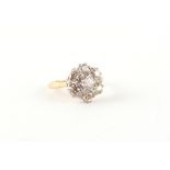 An 18ct yellow gold diamond cluster ring, the seven Old European cut diamonds weighing an