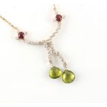 A peridot pink tourmaline & diamond pendant necklace, of ribbon form with two faceted drop