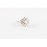 Property of a lady - an 18ct white gold diamond cluster ring, with nine round brilliant cut