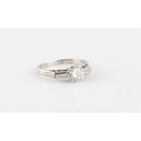 A platinum diamond single stone ring, the round brilliant cut diamond weighing approximately 0.70