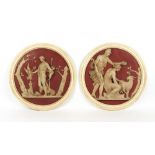 Property of a lady - a large pair of decorative roundels decorated in relief with classical figures,