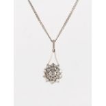 A rose cut diamond flowerhead pendant, with closed back setting, on later associated chain necklace,