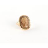 A well carved agate hardstone cameo ring, probably 18th century, depicting a bust of a Roman