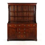 Property of a lady - a George III oak two-part Welsh dresser, the base with an arrangement of six