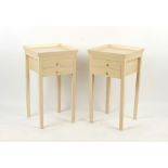 Property of a lady - a pair of cream painted bedside tables, each with two drawers, each 16.5ins. (
