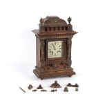 Property of a lady - a late 19th / early 20th century carved mantel clock, striking on a coiled
