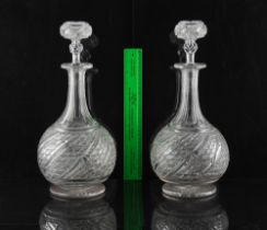 A good pair of large cut glass decanters with stoppers, early 20th century, 15.2ins. (38.5cms.) high