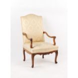 Property of a lady - an 18th century French Louis XV carved fruitwood fauteuil, with cabriole legs.