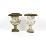 Property of a gentleman - a pair of weathered reconstituted stone garden urns, two-part, decorated
