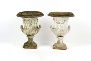 Property of a gentleman - a pair of weathered reconstituted stone garden urns, two-part, decorated