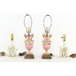 Property of a lady - a pair of 19th century pink ground porcelain vases, mounted as table lamps,