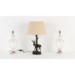 A pair of clear glass urn shaped table lamps, with shades, each approximately 27.5ins. (70cms.) high