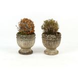 Property of a deceased estate - a pair of weathered reconstituted stone garden planters, each