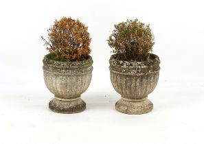 Property of a deceased estate - a pair of weathered reconstituted stone garden planters, each