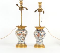 Property of a lady - a pair of Japanese Imari baluster vases, Edo period, 18th century, mounted as