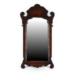Property of a gentleman - a George II style walnut fretwork framed wall mirror, early 20th
