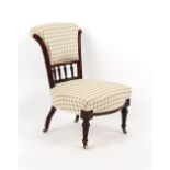 Property of a lady - a late Victorian walnut nursing chair, re-upholstered, on turned front legs &