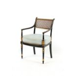 Property of a lady - a 19th century ebonised & parcel gilt elbow chair with cane panelled back &