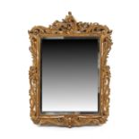 Property of a lady - a late 19th / early 20th century carved giltwood framed wall mirror, with