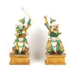 Property of a lady - a large pair of Chinese sancai glazed biscuit porcelain figures of warriors,