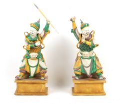 Property of a lady - a large pair of Chinese sancai glazed biscuit porcelain figures of warriors,