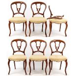 Property of a lady - a set of six Victorian carved balloon back chairs, with cabriole front legs,