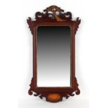 Property of a gentleman - an Edwardian mahogany fretwork framed wall mirror with carved gilt ho-ho