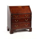 Property of a gentleman - a small George III mahogany fall-front bureau, with three long graduated