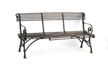 Property of a gentleman - a French Arras or Arras style wrought iron garden bench, with hoof feet,