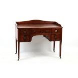 Property of a gentleman - an early 19th century George IV mahogany kneehole dressing table, with low