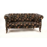Property of a gentleman - a Victorian chesterfield sofa, with turned front legs terminating in black