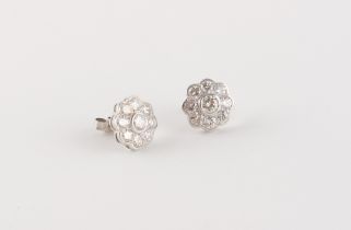A pair of white gold diamond flowerhead stud earrings, the estimated total diamond weight 2.0