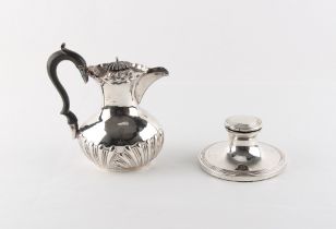 Property of a gentleman - a small early 20th century silver hot water jug, marks rubbed, 6.1ins. (