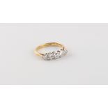An 18ct yellow gold diamond five stone ring, the five round brilliant cut diamonds weighing an