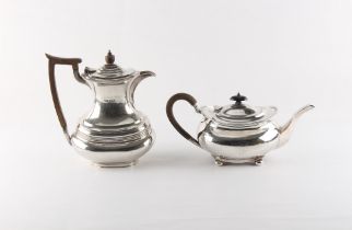 Property of a lady - an early 20th century silver oval teapot, faint engraved crest & monogram,