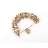 Property of a deceased estate - a 9ct yellow gold gate link bracelet with heart shaped clasp, with