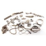 Property of a gentleman - a bag containing assorted silver jewellery including two charm