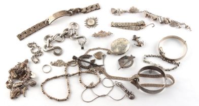 Property of a gentleman - a bag containing assorted silver jewellery including two charm
