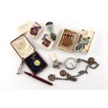 Property of a gentleman - a bag containing assorted items including a silver pocket watch on