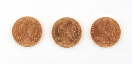 Property of a lady - gold coins - three 1909 French 20 franc gold coins or Napoleons, rooster