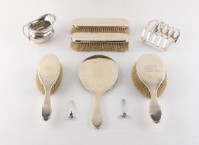 Property of a lady - a small quantity of silver items including a toast rack & a milk jug,