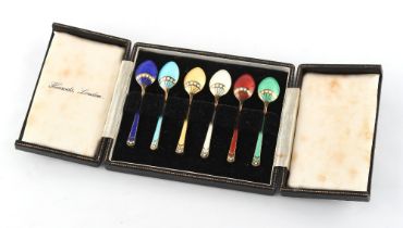 Property of a lady - a cased set of six silver gilt & enamel coffee spoons, retailed by Harrods,