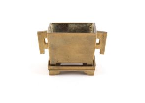 A Chinese bronze rectangular censer with stand, 18th / 19th century, the censer with 4-character