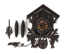 Property of a lady - a late 19th century Black Forest carved wood cuckoo clock, the case 17.