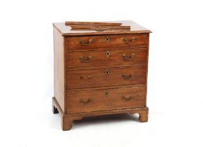 Property of a gentleman - a small George III mahogany chest of four long graduated drawers, on